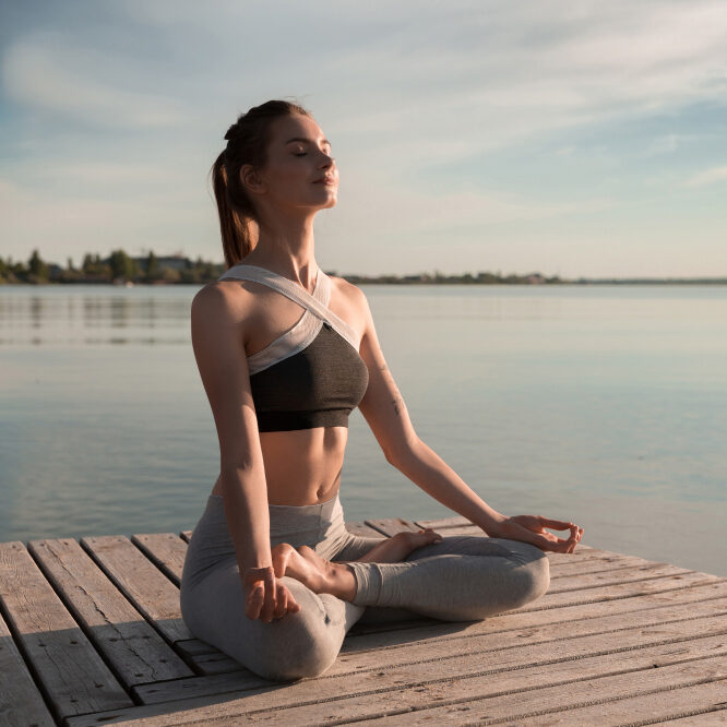 young-sports-lady-beach-make-meditation-exercises